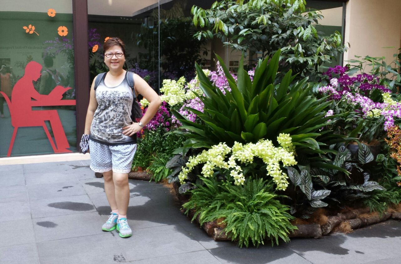 June posing with floral and fauna