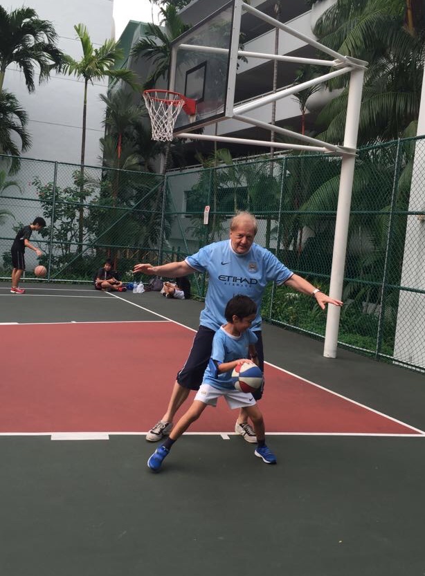 Mike playing basketball with his son