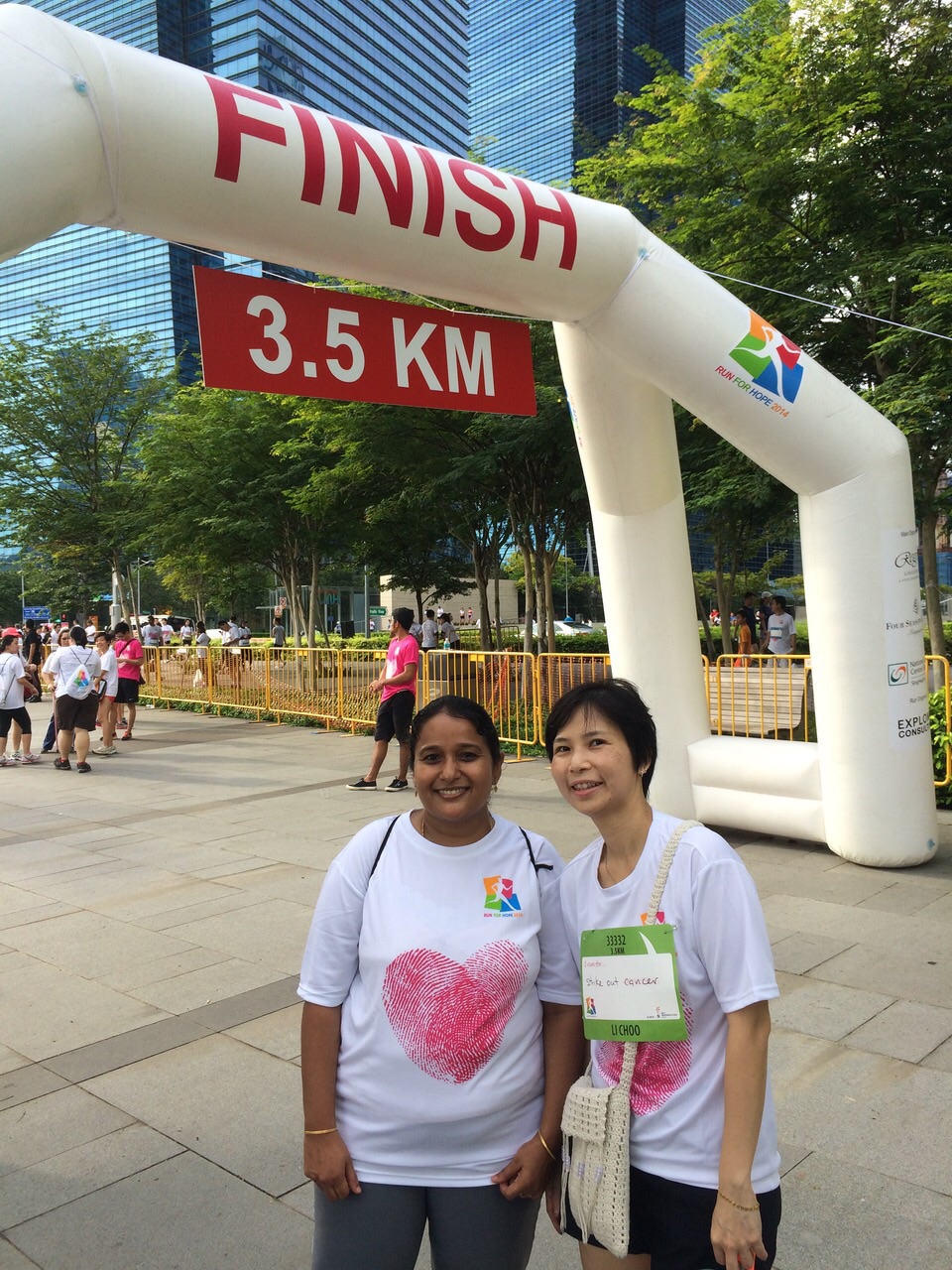 Yvonne at the finish line of a marathon